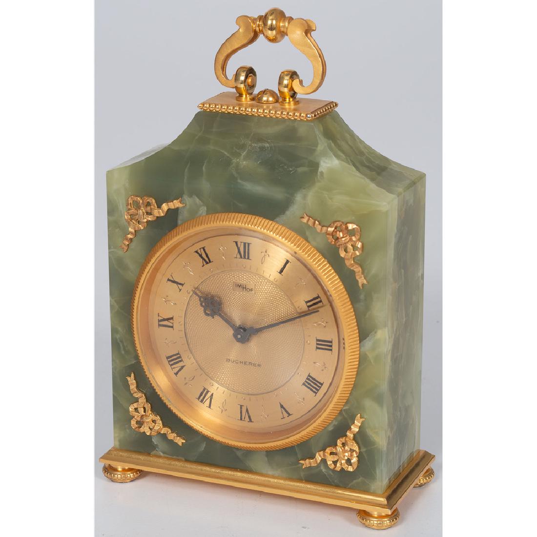 Imhof Onyx Clock: Swiss, 20th century. A brass and onyx clock by Imhof , serial no. 1657433, retailed by Bucherer ; ht. 6.75 in. Provenance: Property from the Americana Collection of Robert and Barbara Hudson, Lakewood