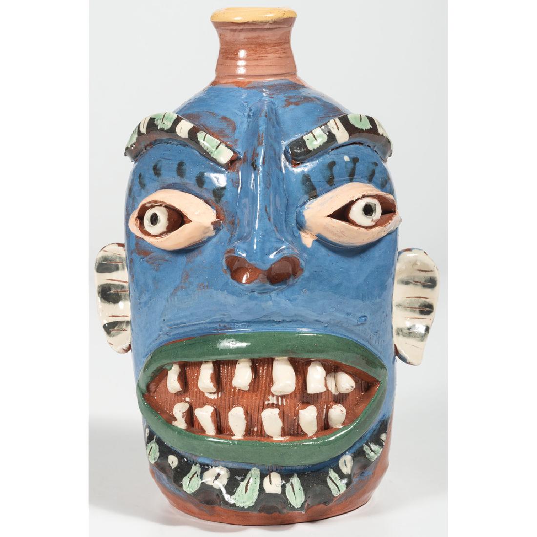 Carl Block Face Jug: American, 20th century. A pottery face jug by Carl Block, signed near base; ht. 10 in.