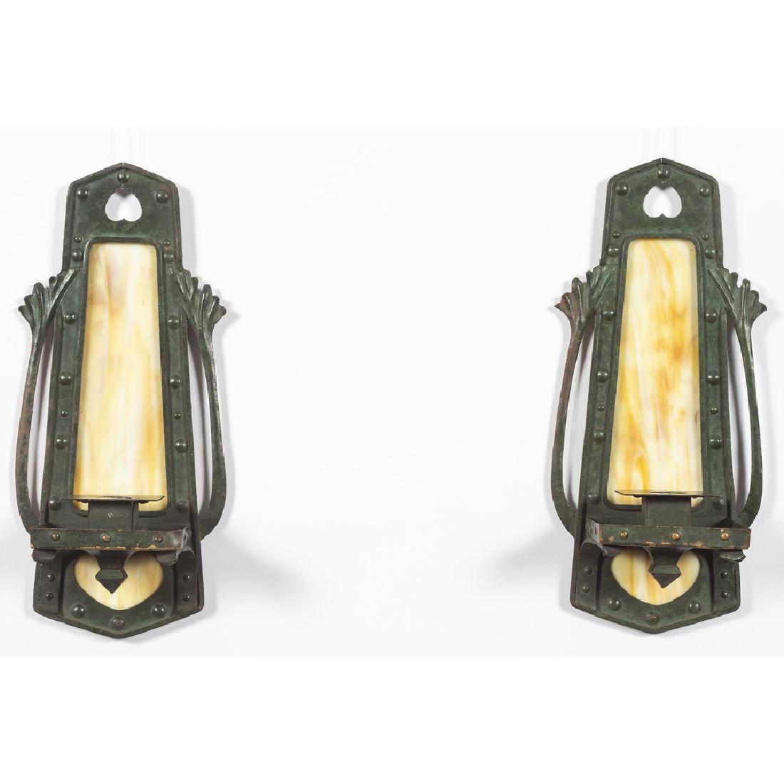 Arts and Crafts Candle Sconces: Early 20th century. A pair of Arts and Crafts metal candle sconces with slag glass panels, unmarked; ht. 12, dp. 3.75 in. (each).