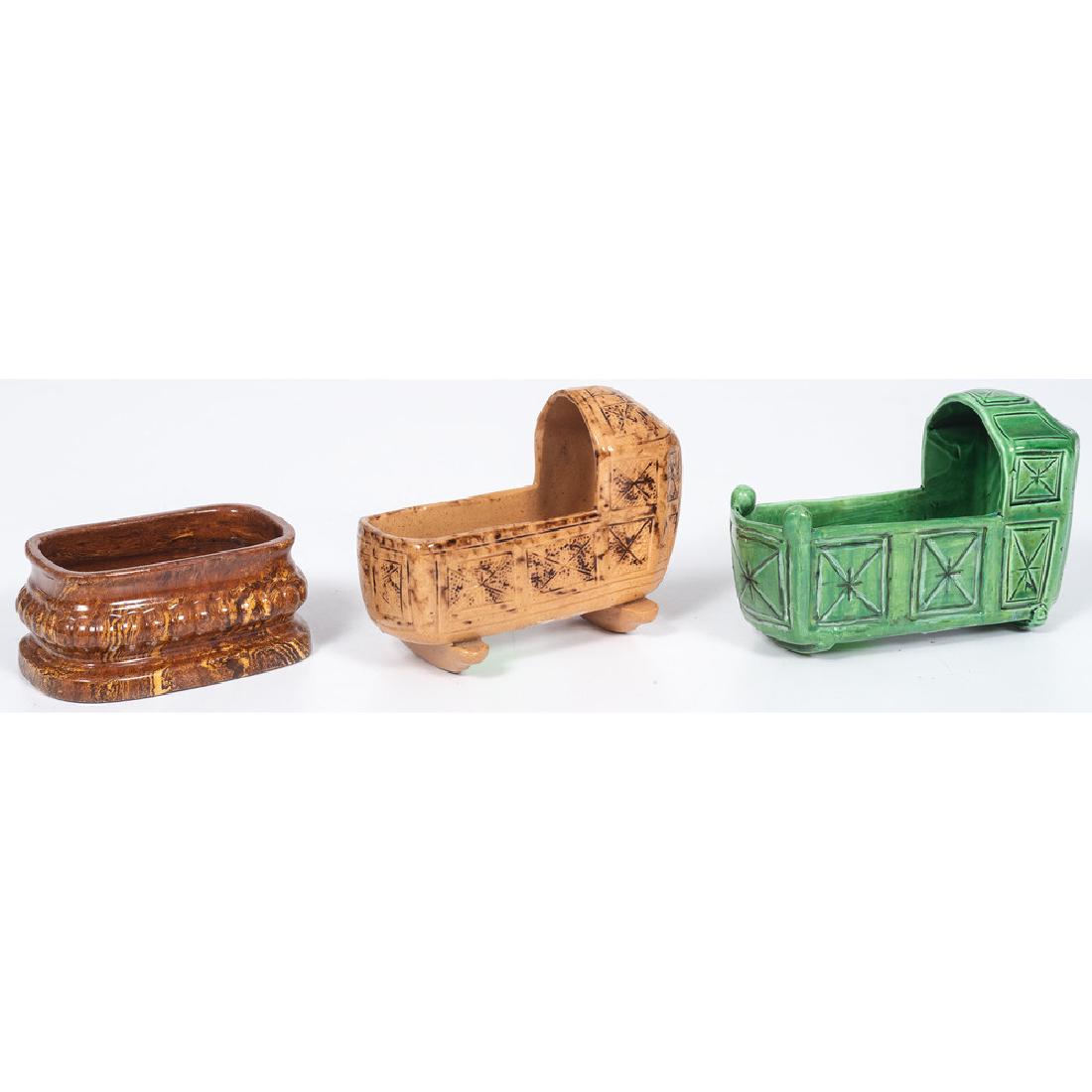 Bennington and Stoneware Cradles and Salt: Two glazed stoneware cradles and salt; largest ht. 3.25, lg. 4.5 in.