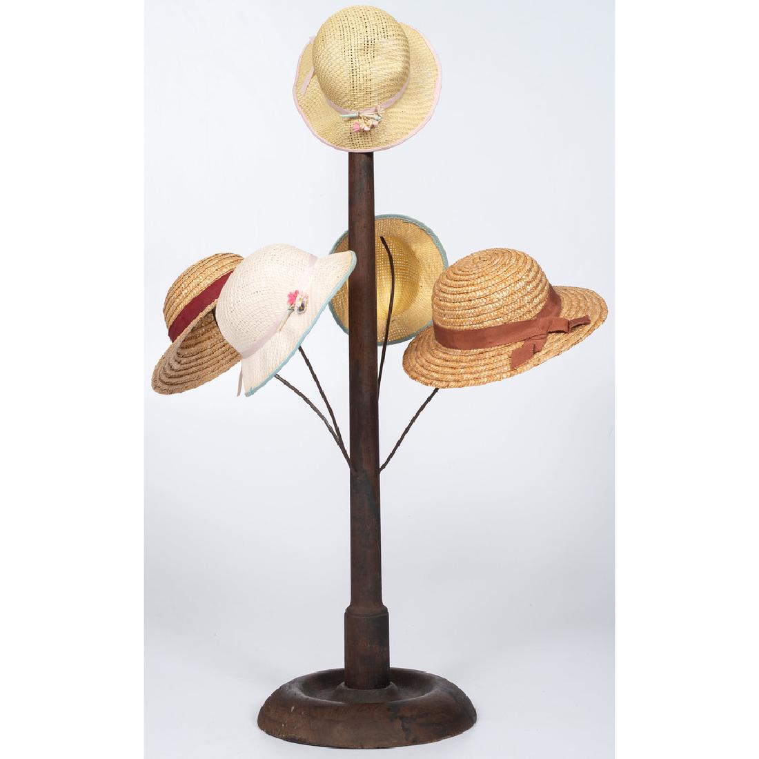 Country Store Hat Rack: American, late 19th-early 20th century. A countertop store hat rack with four wire arms and a mushroom-form finial, with five straw hats; ht. 29 in.