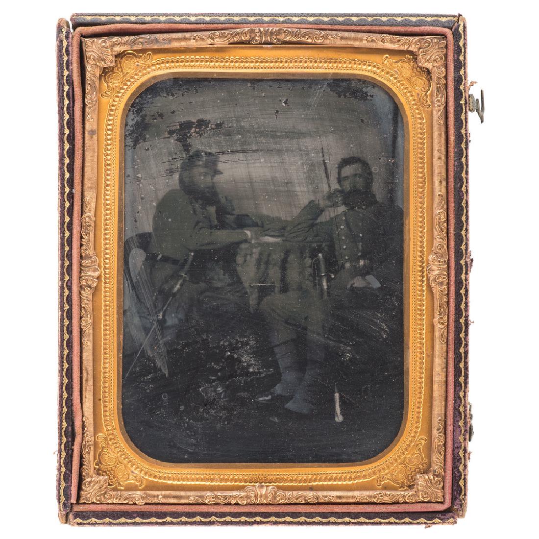Half Plate Ambrotype of Confederate Officers, Incl.: Half Plate Ambrotype of Confederate Officers, Incl. Lieutenant Colonel Charles F. Johnson Half plate ruby ambrotype featuring two Confederate officers seated at a table with their swords, one of whom 