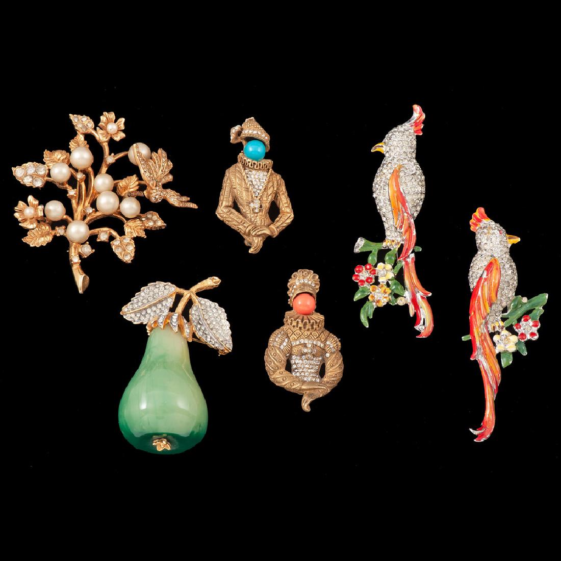 Hattie Carnegie Trembler PLUS: To include a signed gold tone trembler brooch by Hattie Carnegie, a pair of gold tone brooches by Kramer, a pear brooch by Kenneth Jay Lane, and a pair of unsigned cockatiel dress clips.