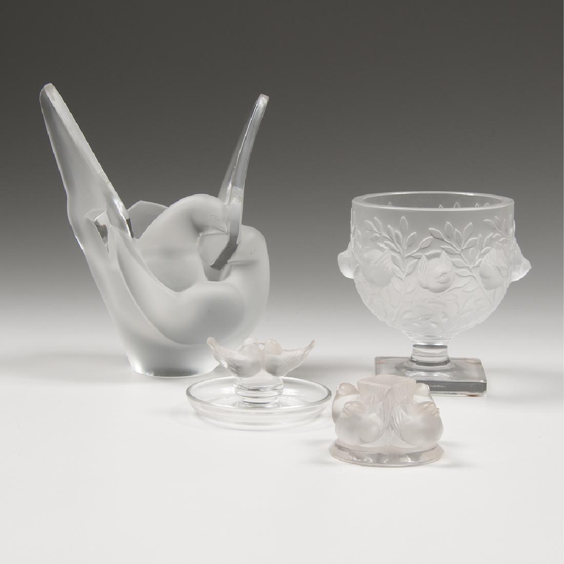 Lalique Bird Bowls and Sculptures: Lalique Bird Bowls and Sculptures French, 20th century. Four pieces of Lalique crystal, including one Elisabeth vase, one Slyvie lovebirds flower frog, one Deux Colombes or lovebirds dish, and one ped