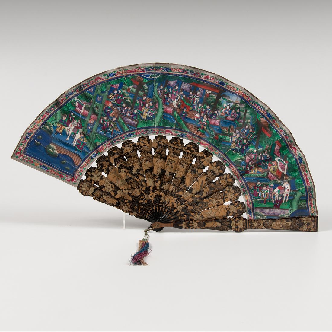 Chinese Painted Fan with Lacquer Box: Chinese Painted Fan with Lacquer Box Chinese, 19th century. A painted fan with lacquer ribs, each side decorated with elaborate genre scenes featuring figures with applied silk robes and faces of pain