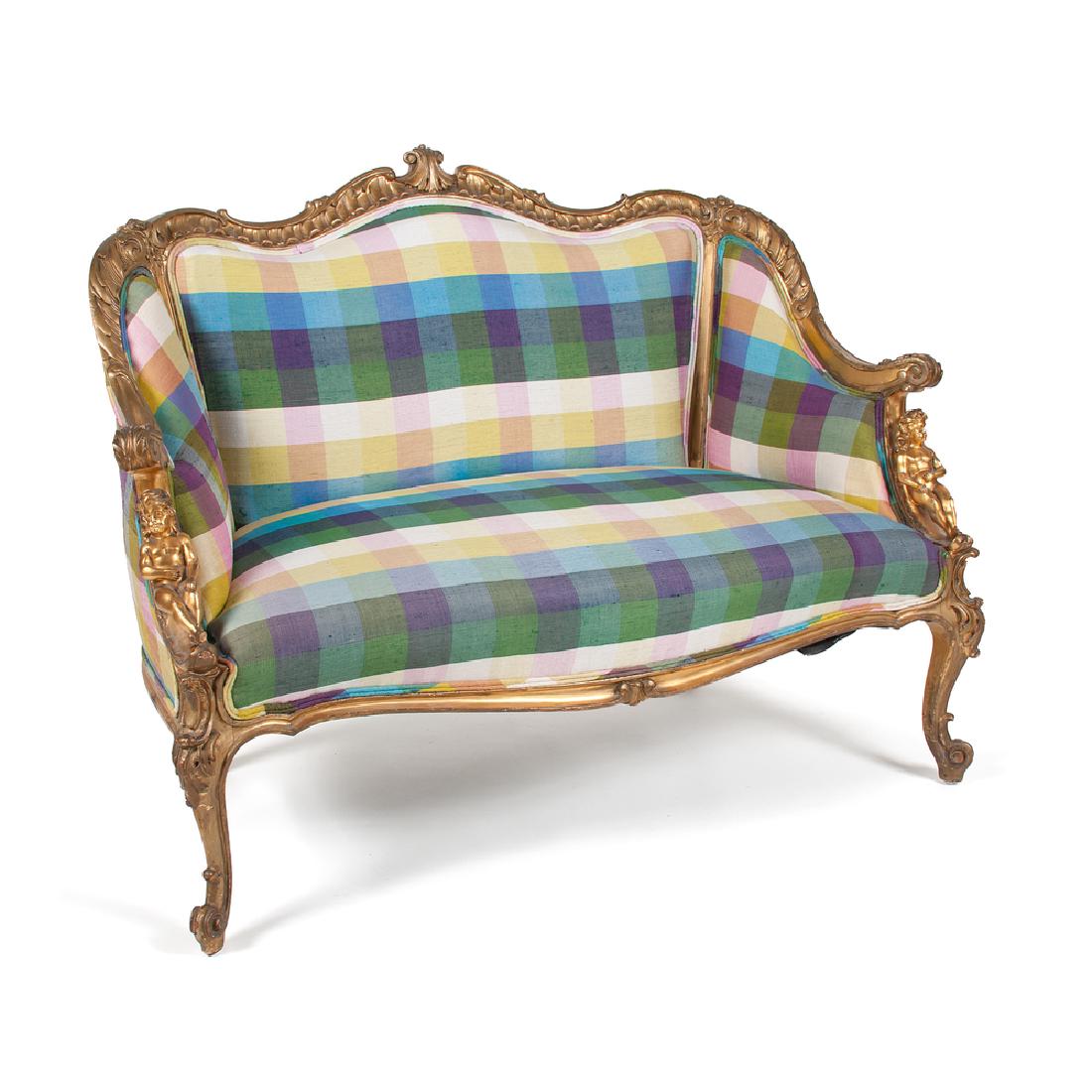 Louis XV Style Gilt Settee: Louis XV Style Gilt Settee French, 20th century. A Louis XV style settee in giltwood with plaid upholstery, having a floral carved and shaped crest, carved arms with putti, and carved seat, all rising