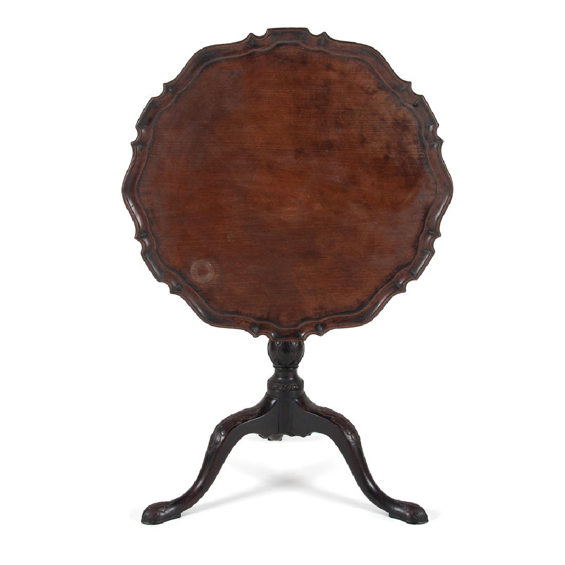 Irish Pie Crust Tilt Top Table: Irish Pie Crust Tilt Top Table Irish, late 18th-early 19th century. A tilt top table in mahogany, having a pie crust tilt top surface over a birdcage and turned and carved standard, all rising on trip