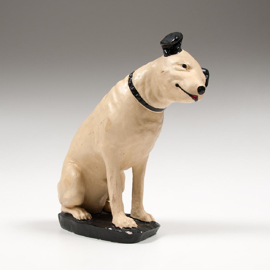 RCA Nipper dog: RCA Nipper dog American, early 20th century. A painted plaster sculpture depicting the RCA Victor dog mascot, Nipper, seated with head tilted; ht. 15, wd. 5, dp. 13 in.