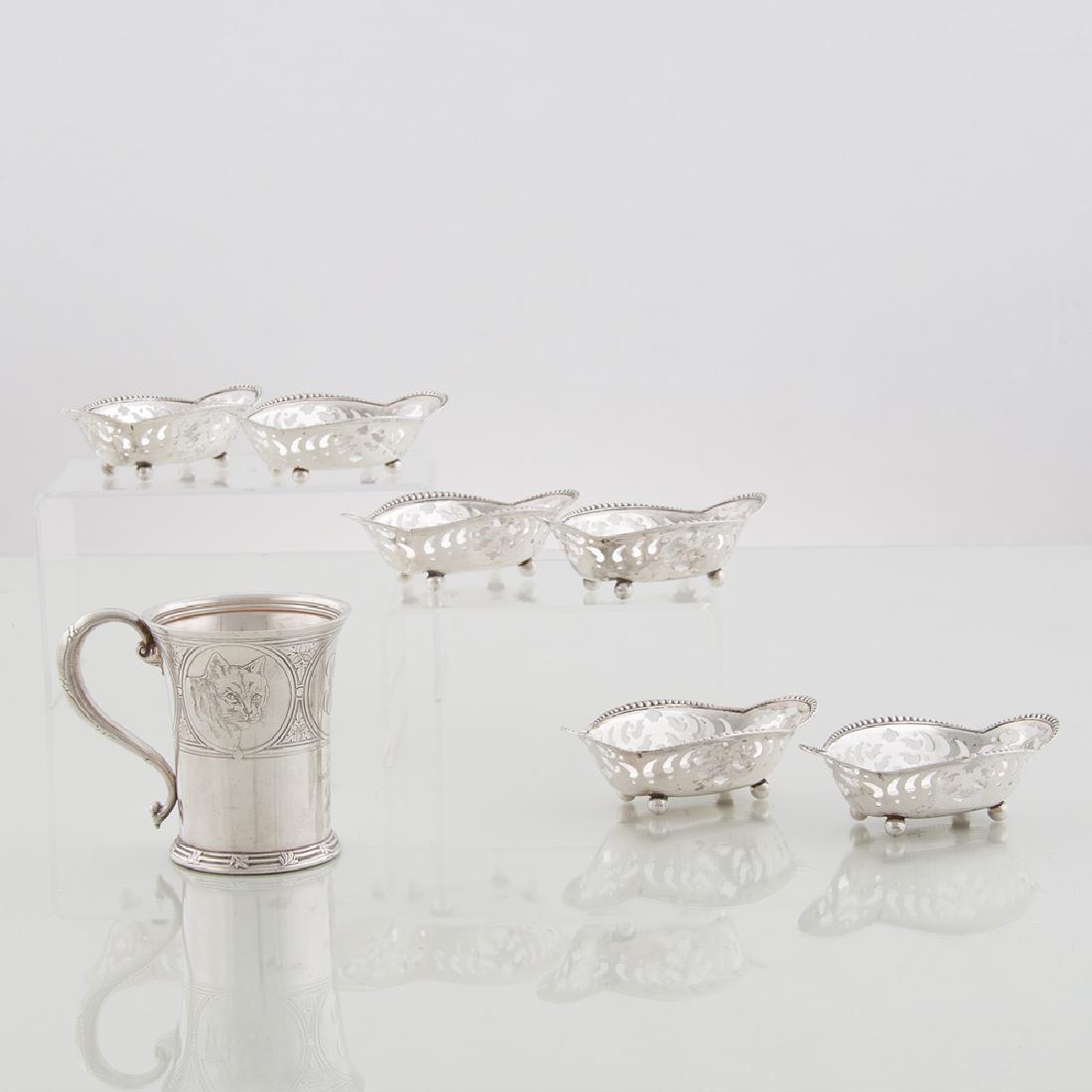 Tiffany Sterling Tablewares: Tiffany Sterling Tablewares American, early 20th century. Seven pieces of sterling silver by Tiffany & Co., including one commemorative mug with leaf motif and etched dog and cat marked 7995 B / 8778,