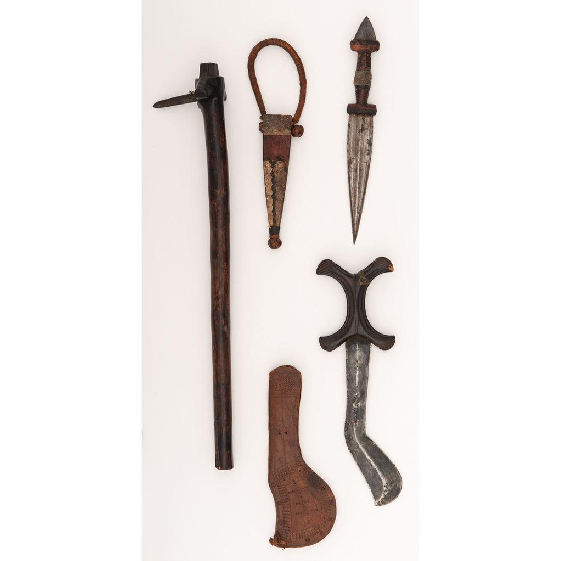 Lot of Three African Weapons: Lot consists of three weapons from the African continent including a 20.25" Cote d'Ivory club with nail-like blade, one Sudanese Beja-type sword with 8.5" blade, and one Sudanese arm dagger with 6.5"