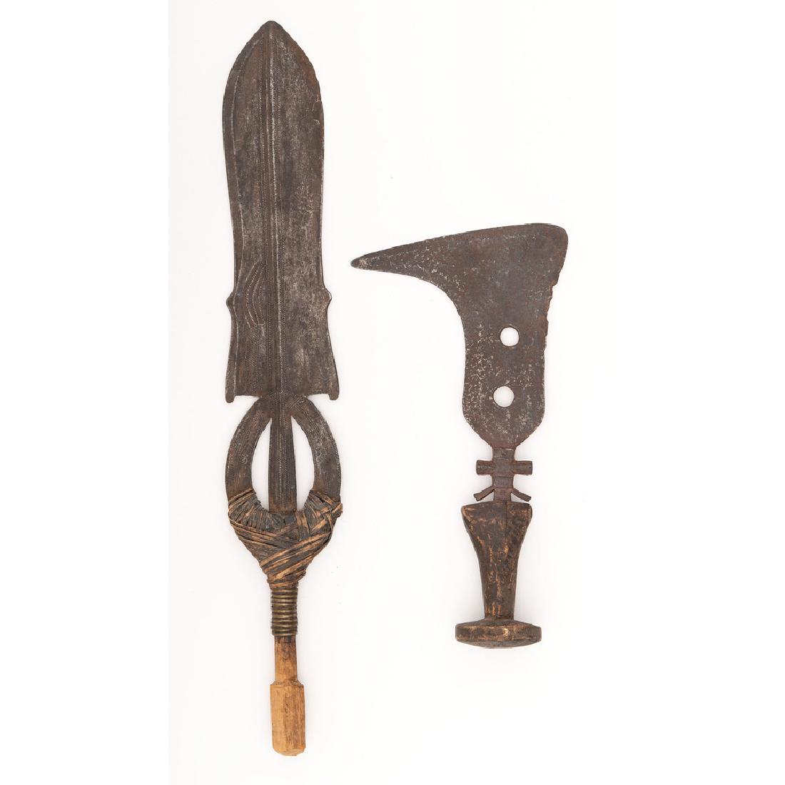 Lot of Two Congolese Edged Weapons: Lot includes two edged weapons of African origin including one mangbetu knife with 9" blade, and one Poto sword with 16" blade.