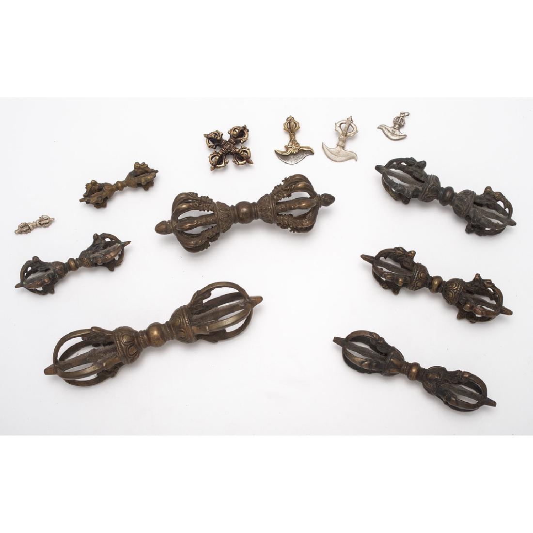 Lot of Seven Tibetan Varjas and Mineature Buddhist: Lot consists of seven Tibetan varjas for ritual use, the largest measuring 6.75". Also includes several diminutive ritual items including varjas, double dorjes, and dakini knives