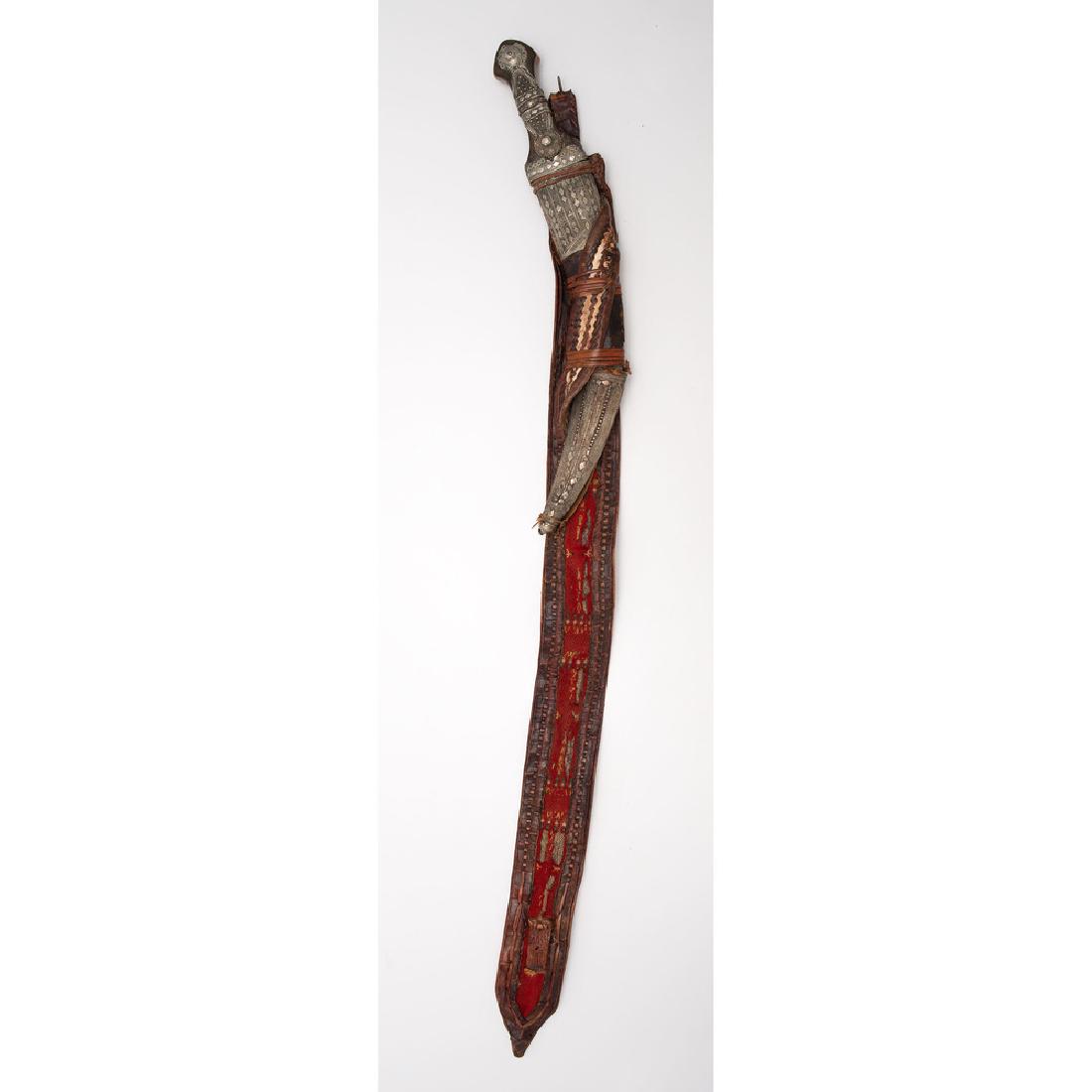 Fine Middle Eastern Jambiyah with Original Belt: 17" knife, horn handle with heavy silver decorations. Wood scabbard covered with silver decorations as well.