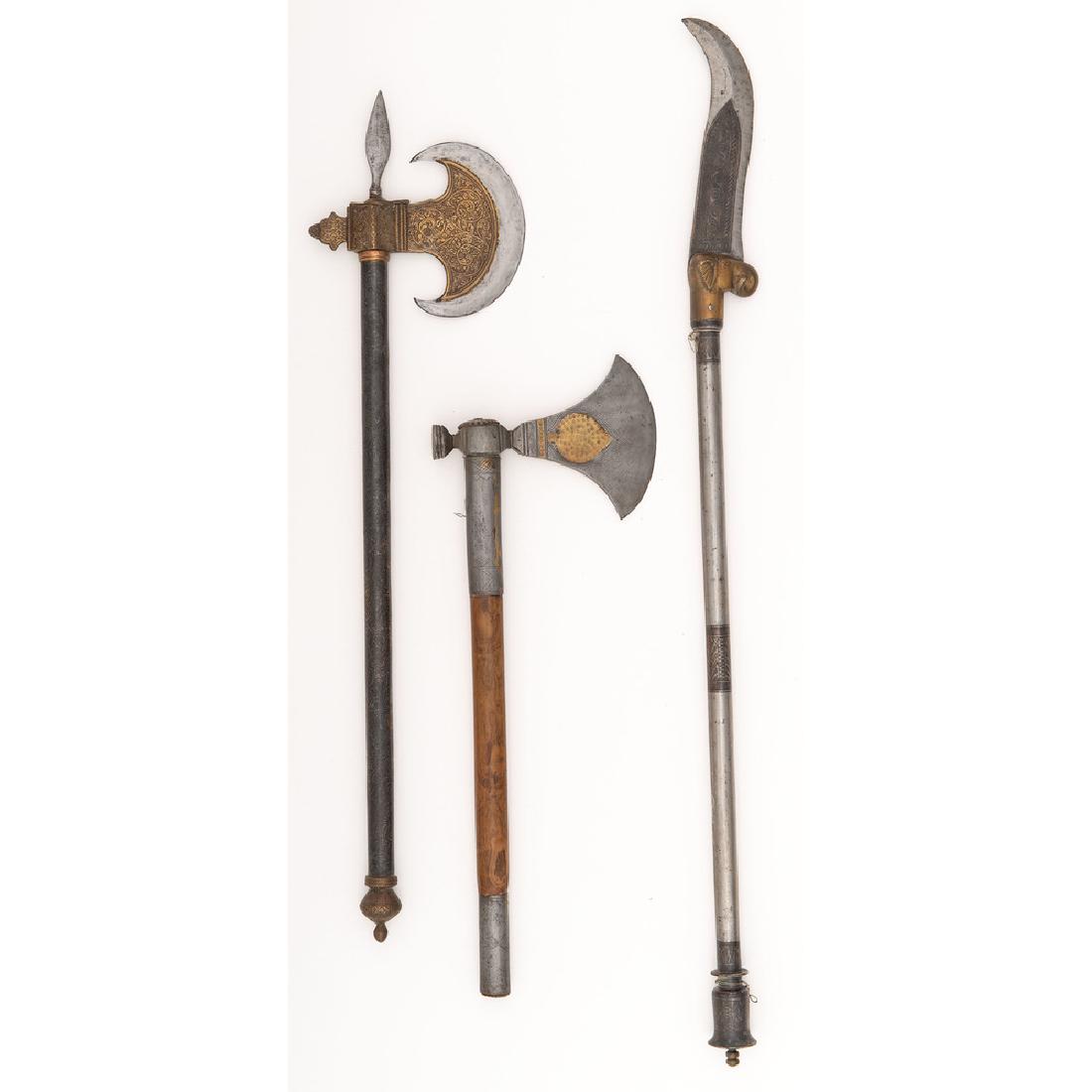Lot of Three Indo-Persian Weapons: Lot consists of three Indo-Persian weapons, likely 19th-20th century, longest measuring 29.5". Shafts include engraving and niello adornment in floral motifs, with heads showing brass inlay and high