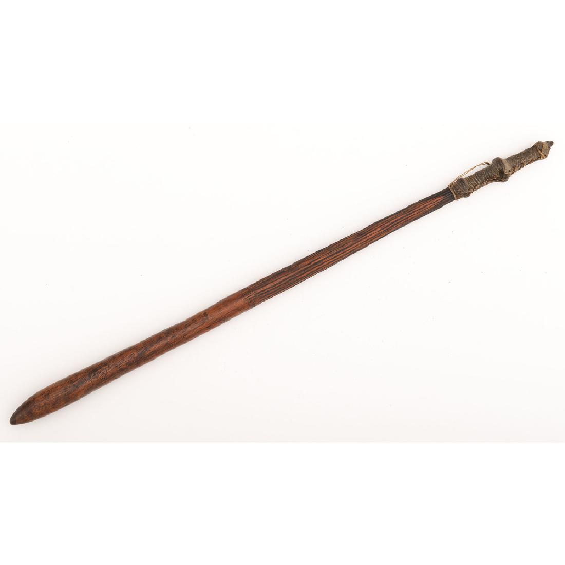Australian Aboriginal Club: 28.5" club with half the club with reeded woodwork. Snakeskin handle. Ca 19th Century.