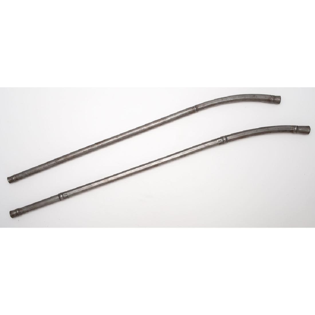 Lot of Two Indian Sota Maces: Lot consists of two steel sota-type maces measuring 27.5" and 29.75". Octagonal-to-round hafts.