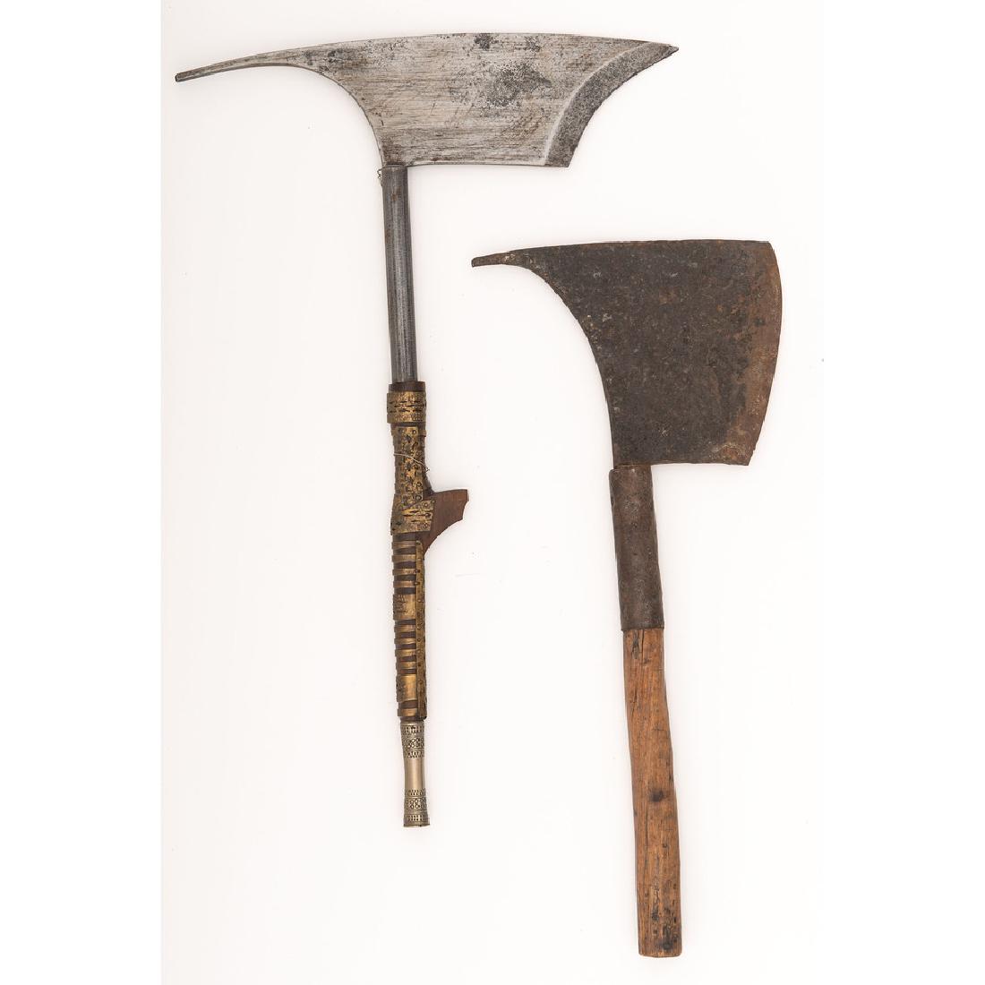 Lot of Two Philippine Axes: First item is a rare Kalinga axe complete with brass decorations on the handle. Axe is complete with metal tip on the base. Second axe is from Bontoc tribe. Near relic iron blade with wood handle. Ca