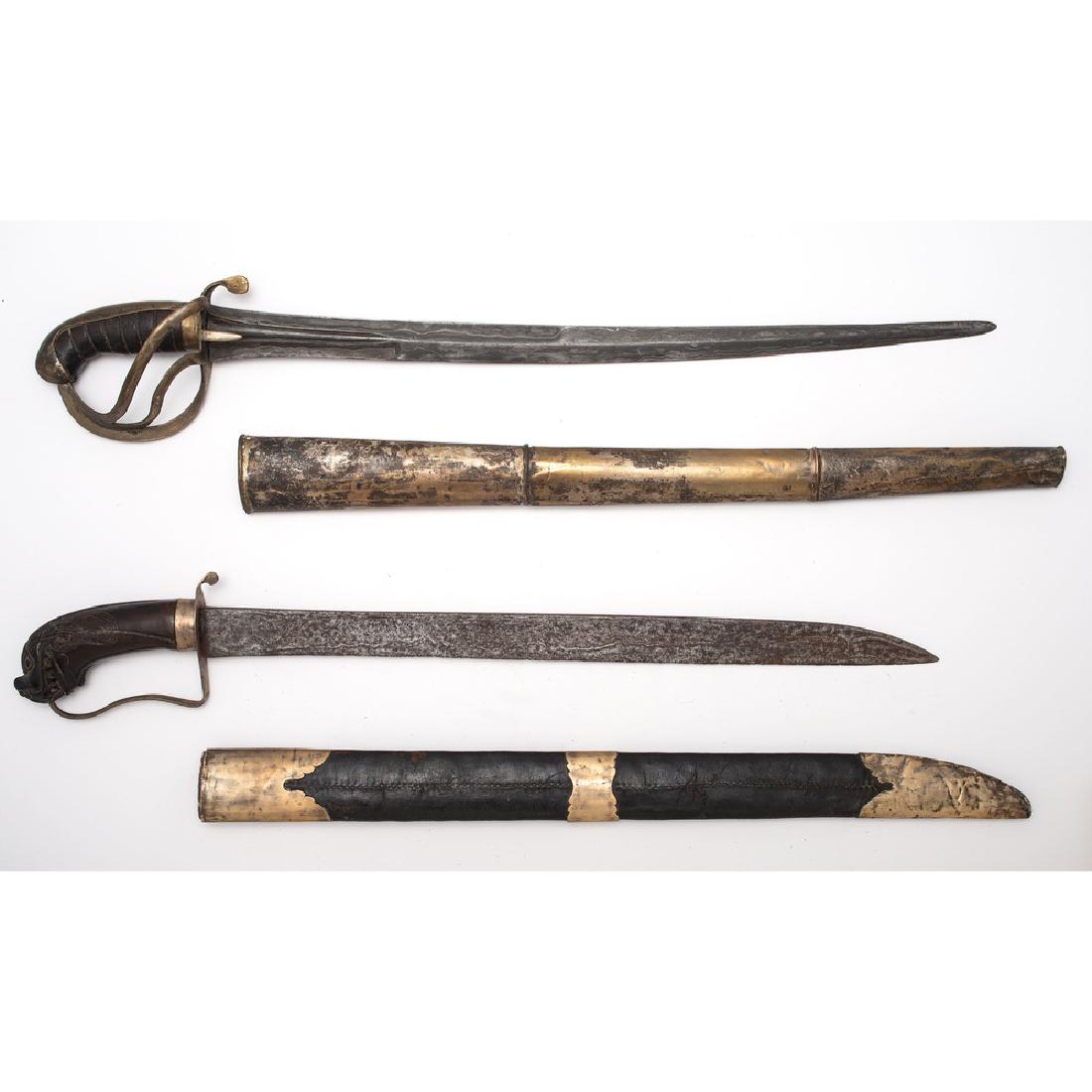 Lot of Two Indonesian Parangs: first item 25.5" with 20.5" blade. European style handle. Single edged blade with typical Indonesian pamor. Scabbard is wood covered with brass. Second item 26" length with 18.5" blade. Handle is comp
