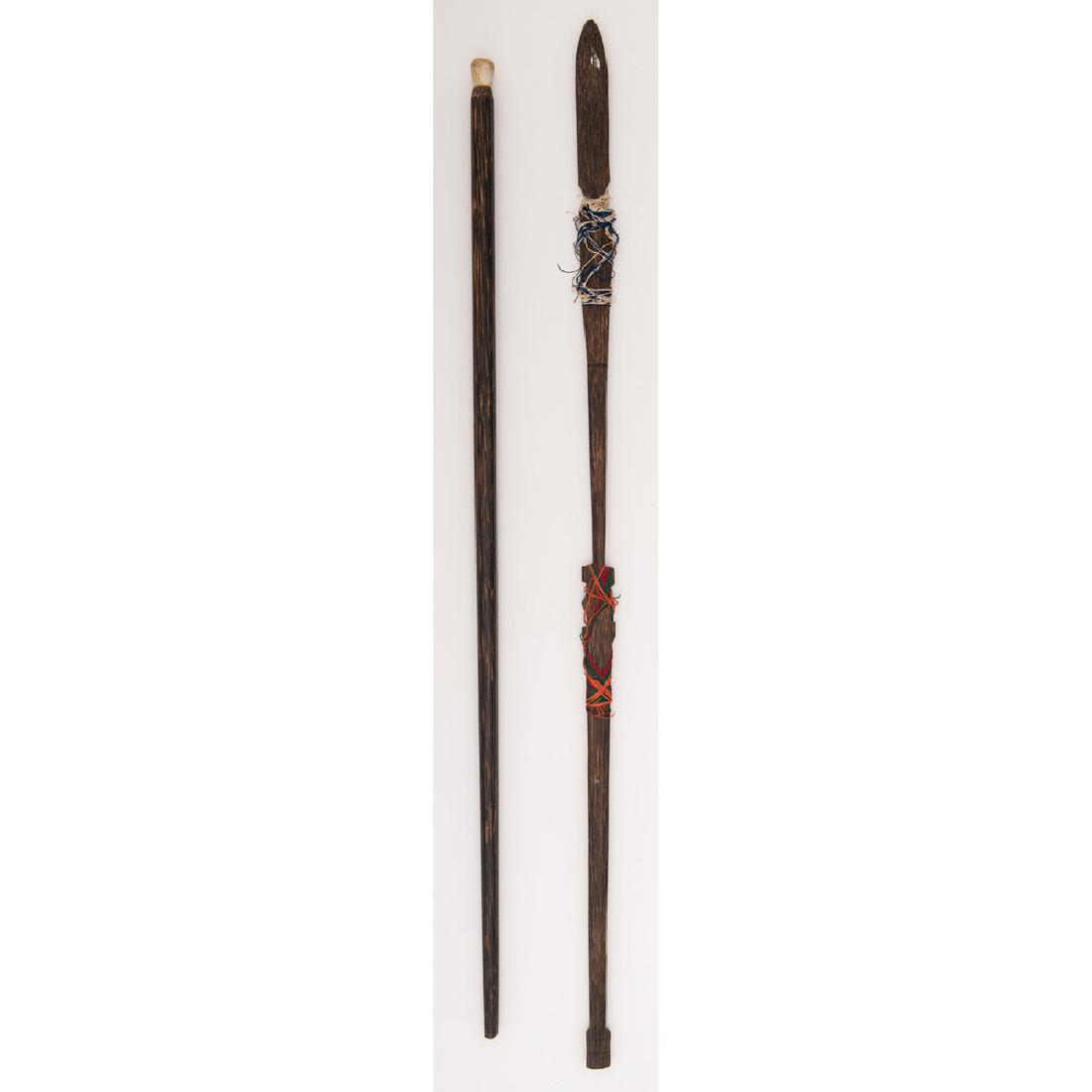 Lot of Fishing Spears: Lot consists of two ethnographic fishing tools including one 53" fishing spear and one 49" spear gun with feather-fletched dart.