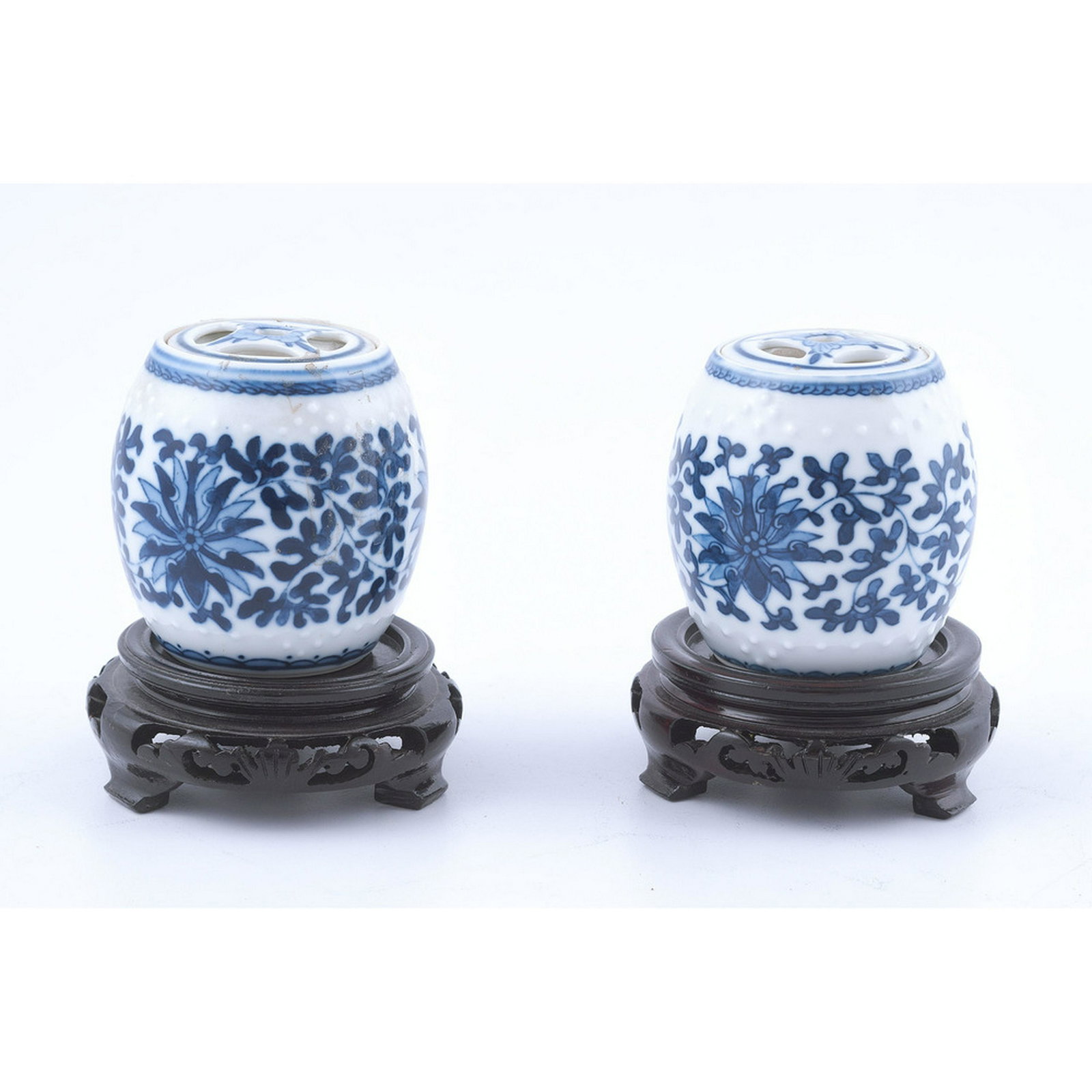 Chinese Blue and White Porcelain Miniature Jars: Chinese Blue and White Porcelain Miniature Jars Chinese, late 19th-early 20th century. A pair of miniature jars or garden stools, with pierced removable lids and blue and white decoration, unmarked. O