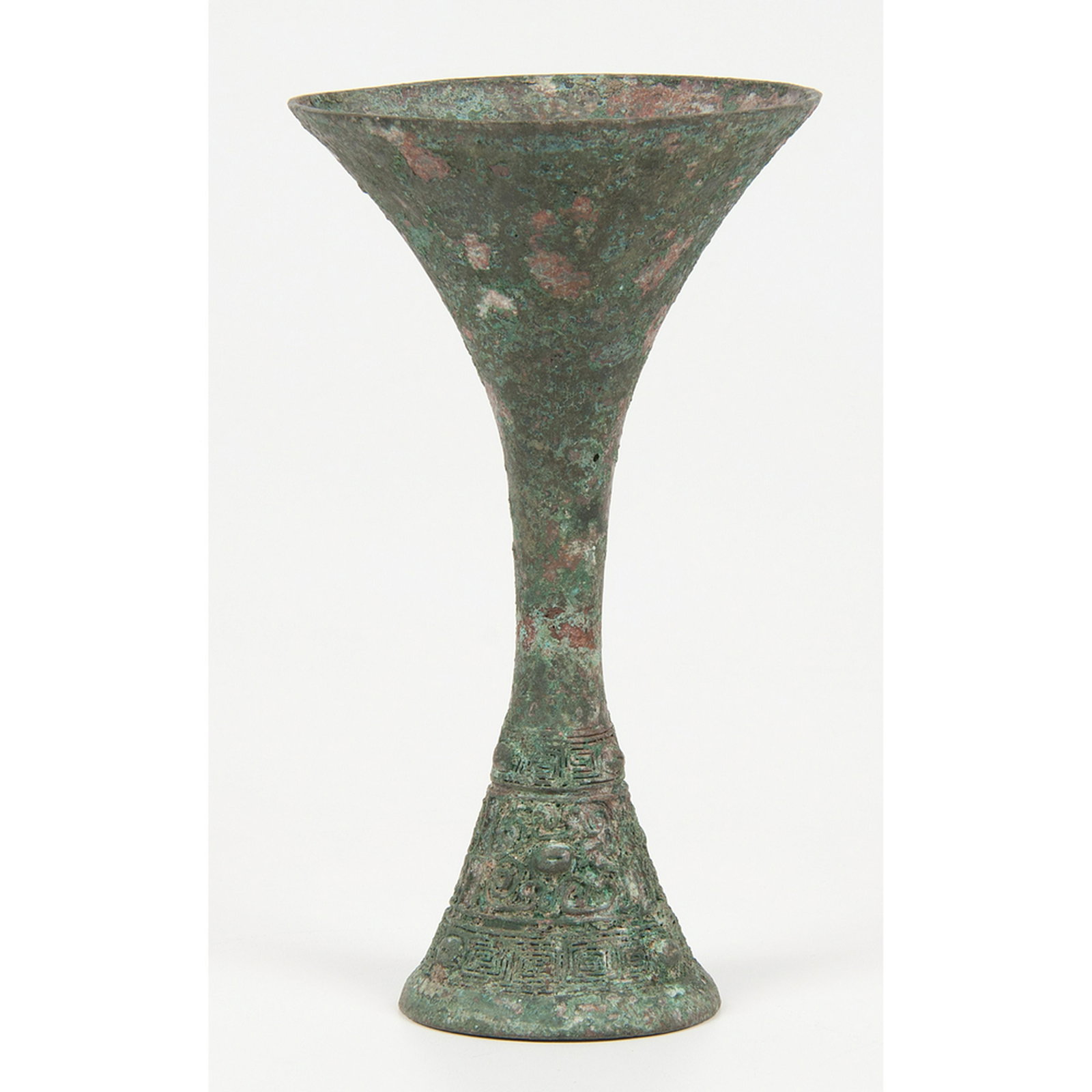 Shang Dynasty Bronze Gu Vessel: Shang Dynasty Bronze Gu Vessel Chinese. A Shang Dynasty bronze Gu vessel; ht. 9, dia. 5.25 in.