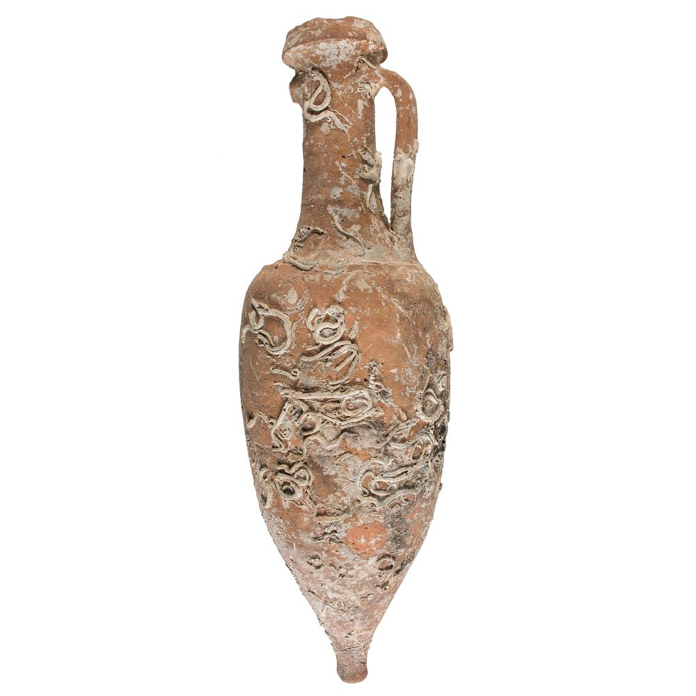 Ancient Mediterranean Amphora: Likely Greek or Roman, 2nd-5th century AD. A shipping amphora with single handle and applied decoration; ht. 39.75 in.