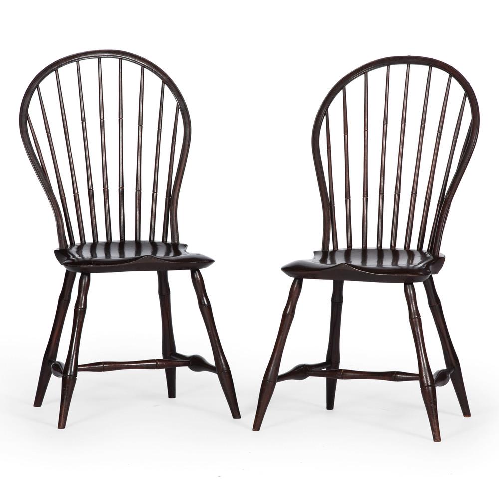 Comb Back Windsor Chairs: American, ca 1800. A pair of comb back windsor chairs in mixed woods, having nine spindle backs over planks seats, all rising on bamboo turned legs with stretcher support; ht. 39, wd. 19, dp. 18 in. (