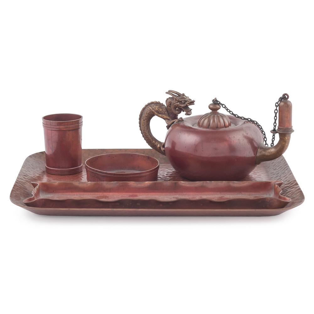 Gorham Copper Desk Accessories: American, 20th century. A group of Gorham copper desk accessories including a hammered tray, a pen tray, two barrel form vessels (one possibly a match holder) and a cigar lighter with a dragon form ha
