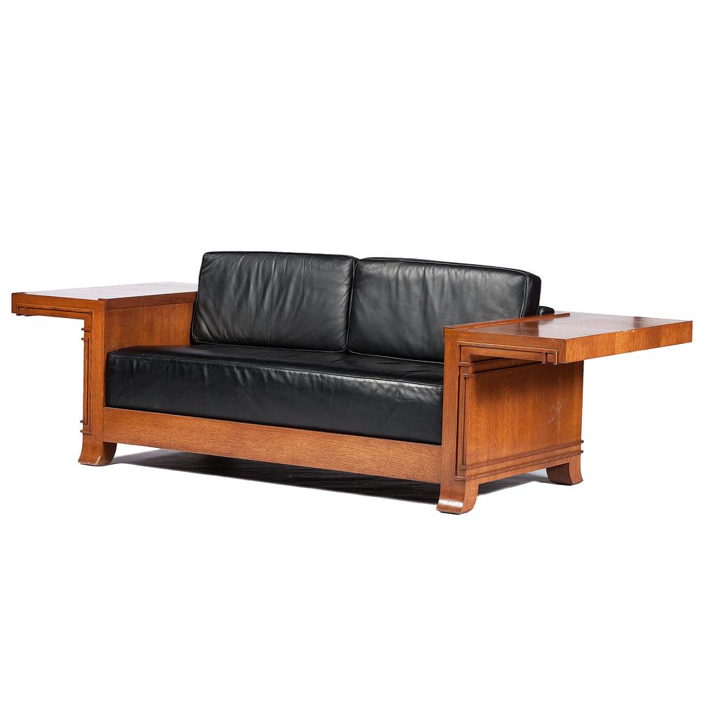 Cantilevered Sofa by Bexley Heath Ltd., After Frank: American, 20th century. A Bexley Heath Ltd. sofa in oak with black leather upholstery, after a design by Frank Lloyd Wright (1867-1959) for the Frederick C. Robie House of Chicago, Illinois, havi
