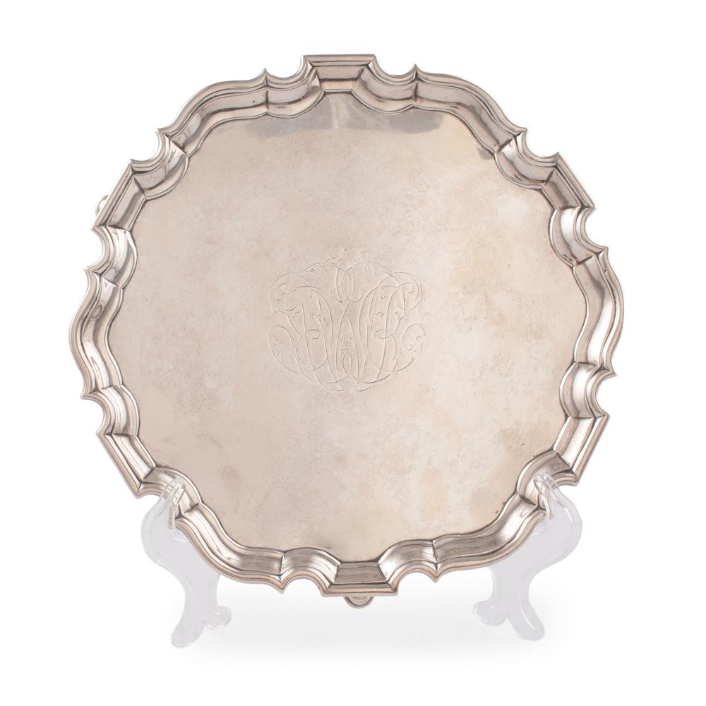 George II Sterling Salver: English (London), ca 1736. A sterling silver salver with scalloped rim and hoof feet, with full hallmarks to underside including maker's mark of Joseph Sanders. Monogrammed; ht. 1.25, wd. 9.5 in., tot