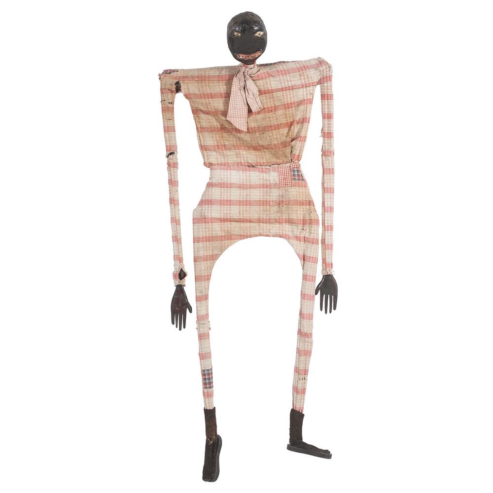 Black Americana Vaudeville Puppet: American, ca 1890-1920. An African-American vaudeville puppet, having a papier-mache head, articulated wooden armature and hand-carved hands and feet, with original paint and clothing; ht. 45.5 in.