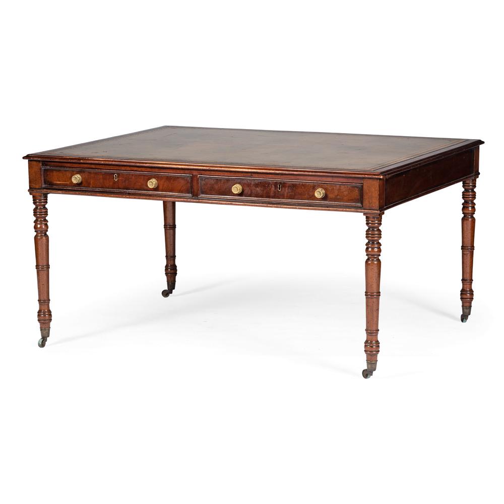 English Partners Desk: English, 19th century. A leather inset partners desk in mahogany, having two aligned drawers with brass pulls, all rising on turned legs with metal casters; ht. 28, wd. 55, dp. 44 in. Provenance: Pr