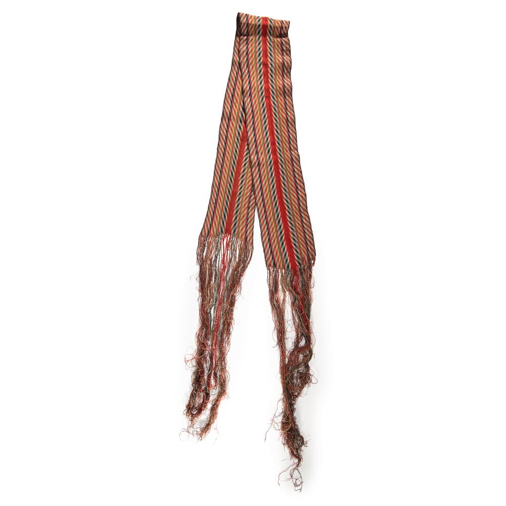 Northeastern Assumption Sash, From the Stanley B.: woven in a zigzagging pattern in colors of red, cream, gold, green, light blue and navy blue; length excluding fringe 78 in. mid-19th century Provenance: From the Stanley Slocum Collection, Minnesota