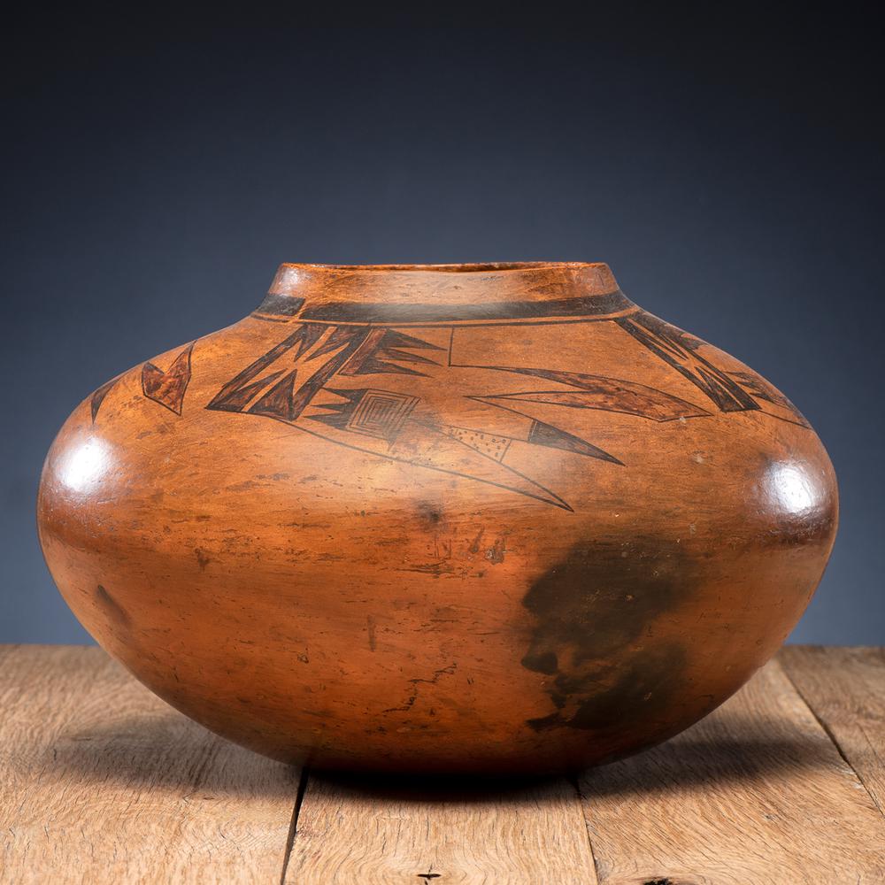 Hopi Redware Jar: large form and painted with winged elements, height 9.75 in. x diameter 15 in. first quarter 20th century