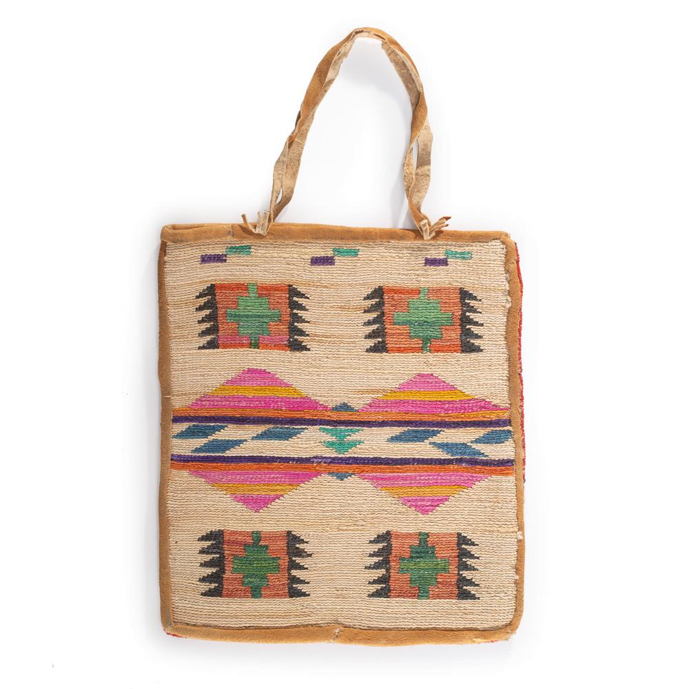 Nez Perce Beaded Corn Husk Flat Bag, From the Stanley: thread-sewn; side A, beaded floral design on canvas, side B features a colorful geometric corn husk panel, height 10.5 in. x width 9.5 in. first quarter 20th century Provenance: From the Stanley Slocu