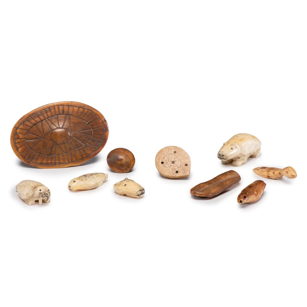 Alaskan Eskimo Carved Game Pieces and Fasteners, From: lot of 9, includes walrus, seal, bear, fox, and bird game pieces; PLUS assorted buttons and fasteners, sizes range from .75 in. - 2.25 in. pre- A.D. 1700 and early 20th century Provenance: From the Co
