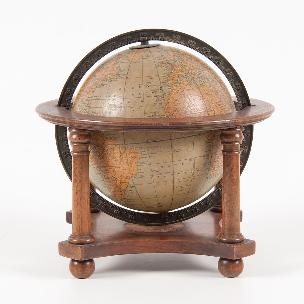 Rand McNally 8 Inch Globe on Stand: American, second half 20th century. A Rand McNally globe with wooden frame; ht. 11, dia. 12 in. Provenance: Property from Donald A. Rich Interiors and Antiques, New Canaan, Connecticut