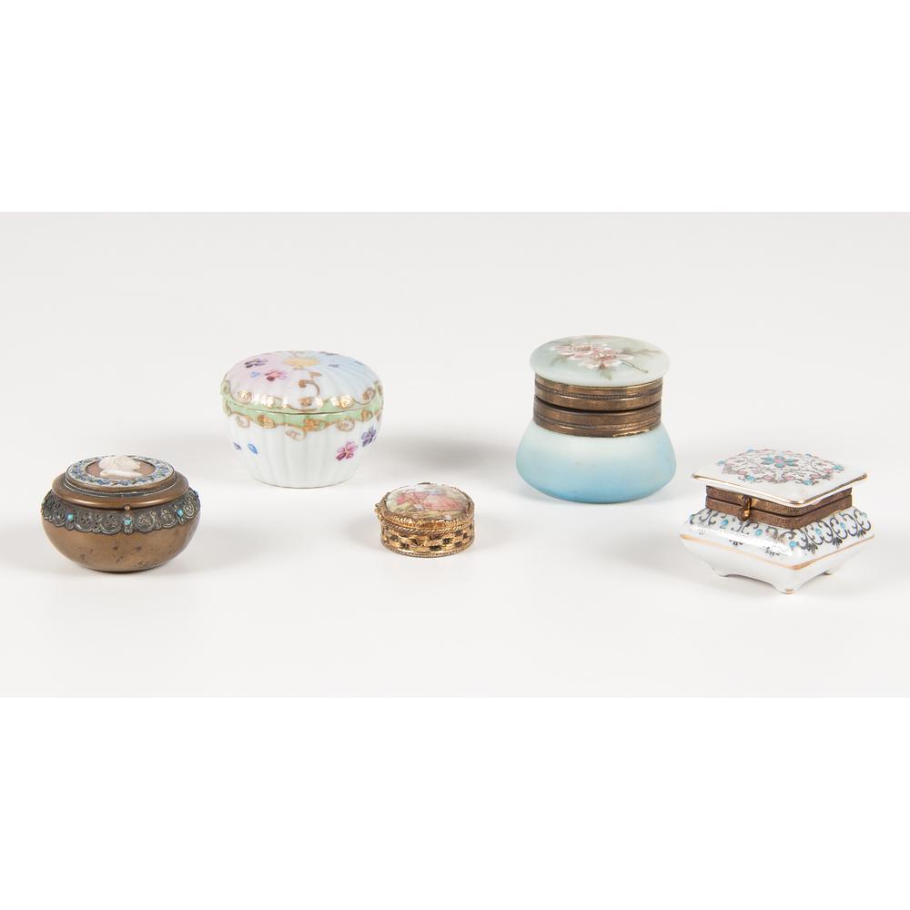 Dresser and Pill Boxes: Late 19th-mid-20th century. An assembled group of five small boxes, including one Nakara porcelain dresser box with painted flowers on hinged lid, marked for maker on underside, one porcelain dresser 