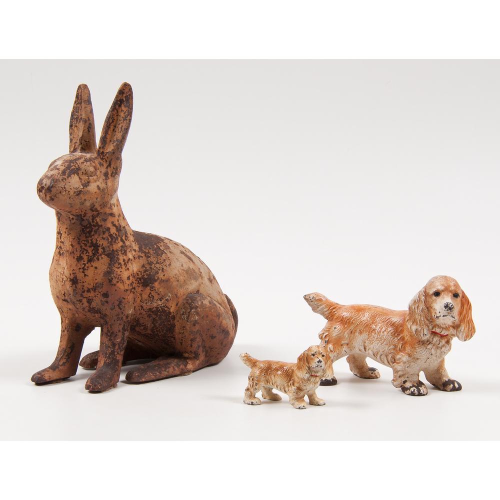 Cast Iron Rabbit Doorstop, Plus: American, late 19th-early 20th century. A cast iron doorstop in the shape of a rabbit; PLUS, two cast iron spaniels; rabbit ht. 11.5, wd. 5, dp. 10 in. Provenance: Property from Donald A. Rich Priva