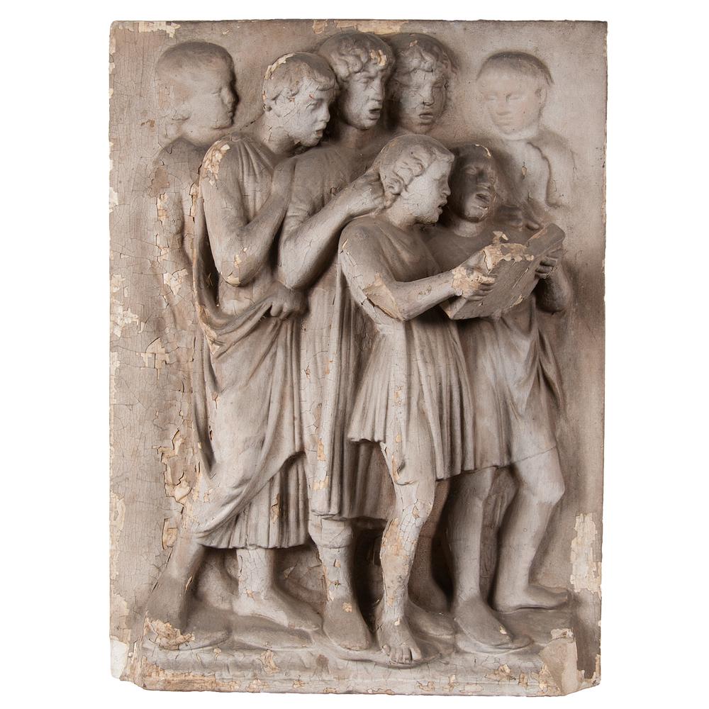P.P. Caproni Painted Plaster Classical Frieze Panel: American, late 19th-early 20th century. A plaster frieze panel by P.P. Caproni with boys singing around a book, unmarked; ht. 20, wd. 15, dp. 7 in.