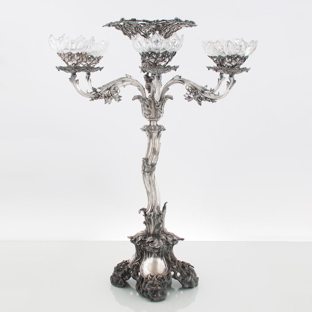 Silver Epergne with Crystal Bowls: American, late 19th-early 20th century. A silver six-arm epergne, having a pierced grapevine and foliate central bowl and arms, the whole of foliate form, on a four-foot base, unmarked; ht. 27.5, wd. 