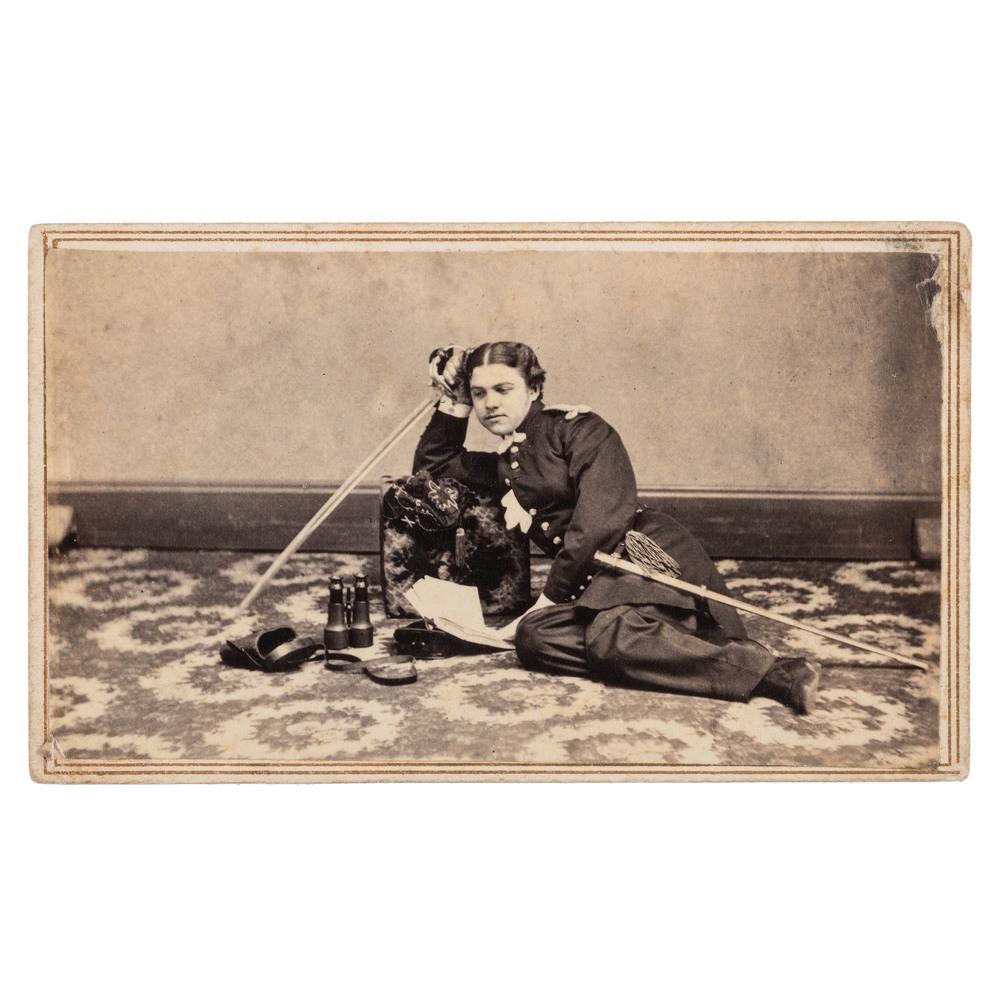 Civil War CDV of Reclining Lieutenant John Aiken: Civil War CDV of Reclining Lieutenant John Aiken Millard Jr., 1st New York Light Artillery CDV of a recumbent soldier in uniform, accented by cuff links and a lace handkerchief. He poses on the boldly