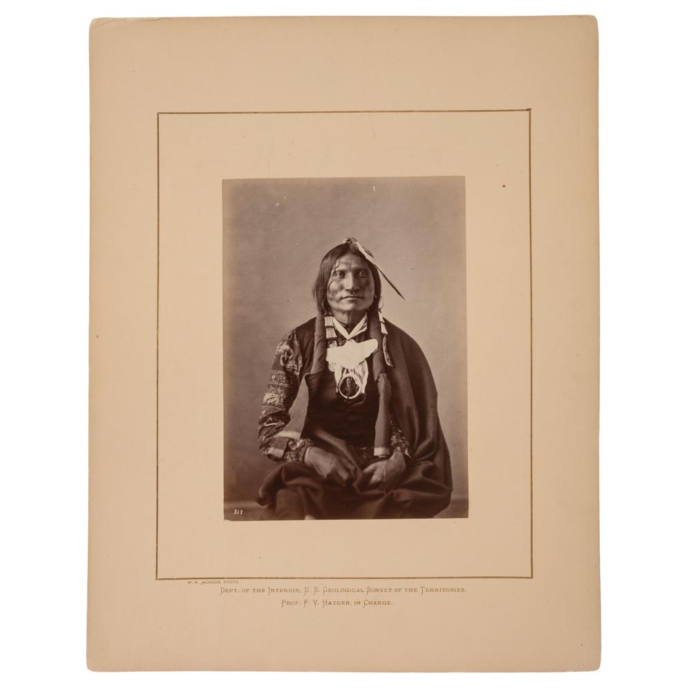 Alexander Gardner Albumen Photograph of Good Buffalo: Alexander Gardner Albumen Photograph of Good Buffalo, Oglala Lakota Albumen photograph, 5.25 x 7.25 in., on 11 x 14 in. Hayden Survey mount with credit at lower left to W.H. Jackson. A studio view of