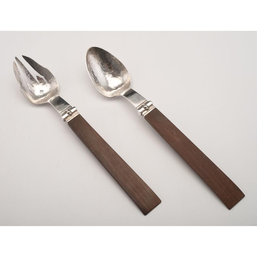 William Spratling Silver Salad Serving Set: Mexican, ca 1940s. A William Spratling silver serving fork and spoon with hammered bowls and wooden handles, both marked on underside of bowl; spoon lg. 12.5 in.