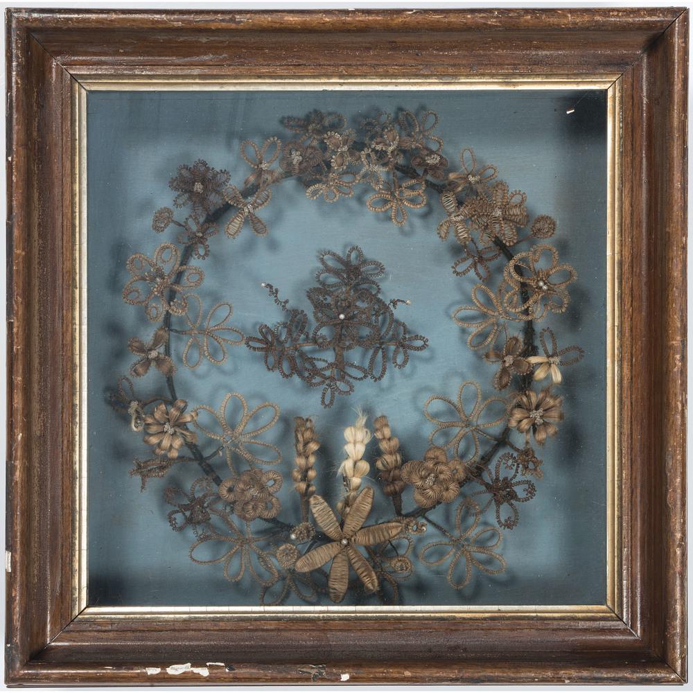 Victorian Mourning Hair Wreath in Shadow Box: Victorian Mourning Hair Wreath in Shadow Box American, late 19th century. A mourning hair wreath with floral motifs mounted in a shadow box; ht. 17.5, wd. 17.5, dp. 5 in. (frame).