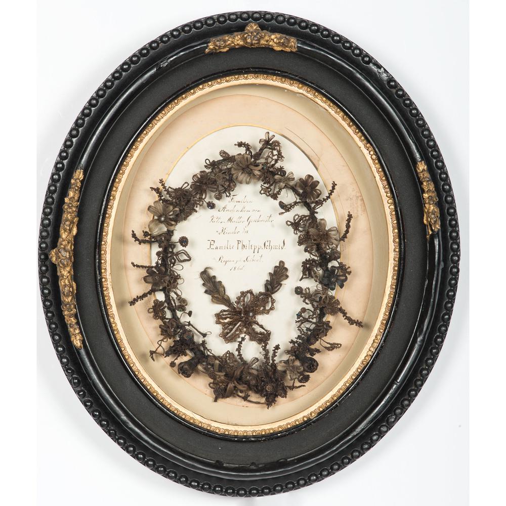 1865 Mourning Hair Wreath in Oval Shadow Box: 1865 Mourning Hair Wreath in Oval Shadow Box Likely German. Hair wreath surmounting a hand-written ink inscription on paper in German reading Familien / Andenken von / Vater, Mutter, Geschwister / & K