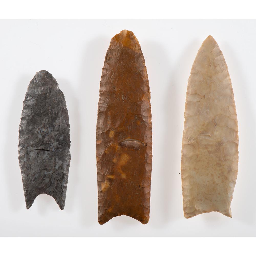 A Group of Clovis and Wheeler Points, Longest 3-3/4 in.: Paleo Indian Period, 13,000-7000 B.C. Lawrence County, Illinois [F86] South Dakota [C335] Brown County, Illinois [D578] lot of 3, longest 3-3/4 in. Collection History Found by Lew Smith in 1933 [D578]