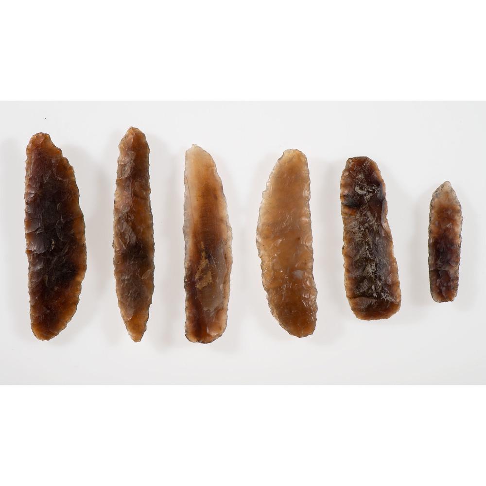 Six Knife River Flint Blades, Longest 3-1/2 in.: Archaic Period, 8000-500 B.C. Stanley County, South Dakota lot of 6, longest 3-1/2 in. Collection History Karl G. Parchert, Dearborn, Michigan