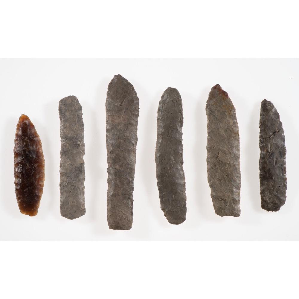 Six Archaic Knife Blades, Longest 4-1/8 in.: Archaic Period, 8000-500 B.C. Stanley County, South Dakota lot of 6, longest 4-1/8 in. Includes one Knife River Flint blade. Collection History Karl G. Parchert, Dearborn, Michigan