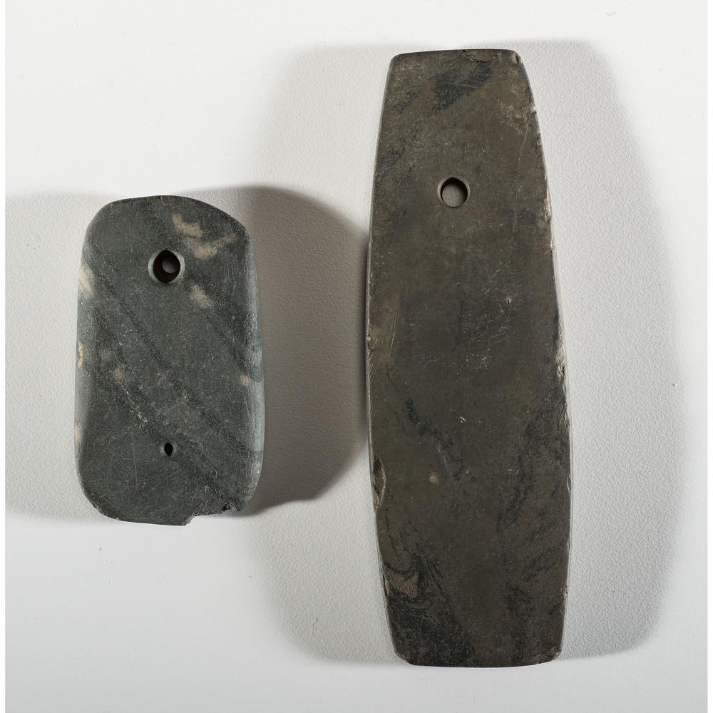 A Pair of Banded Slate Pendants, Longest 4-1/2 in.: Woodland Period, 800 B.C. - A.D. 1200 Van Buren County, Michigan [N-71] Wexford County, Michigan [D77] lot of 2, longest 4-1/2 in. Smallest has one completely drilled hole and another tapped. Collecti